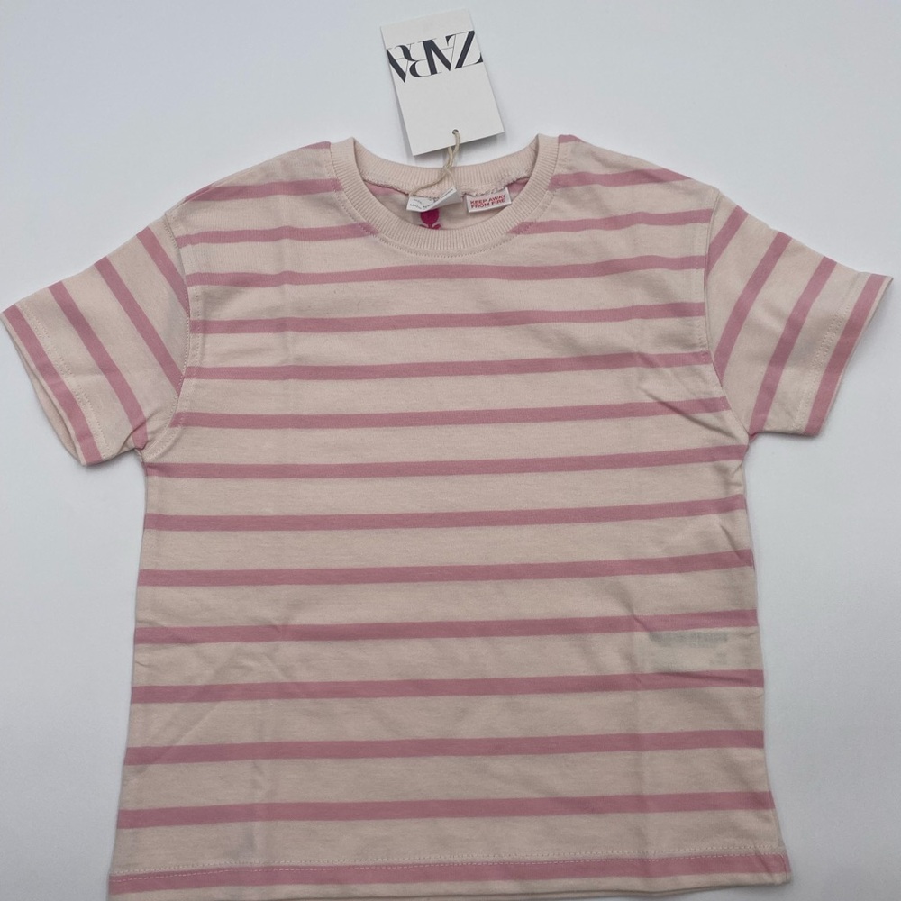 New with tags. Zara Kids Light Pink Striped Tee, perfect for everyday wear.